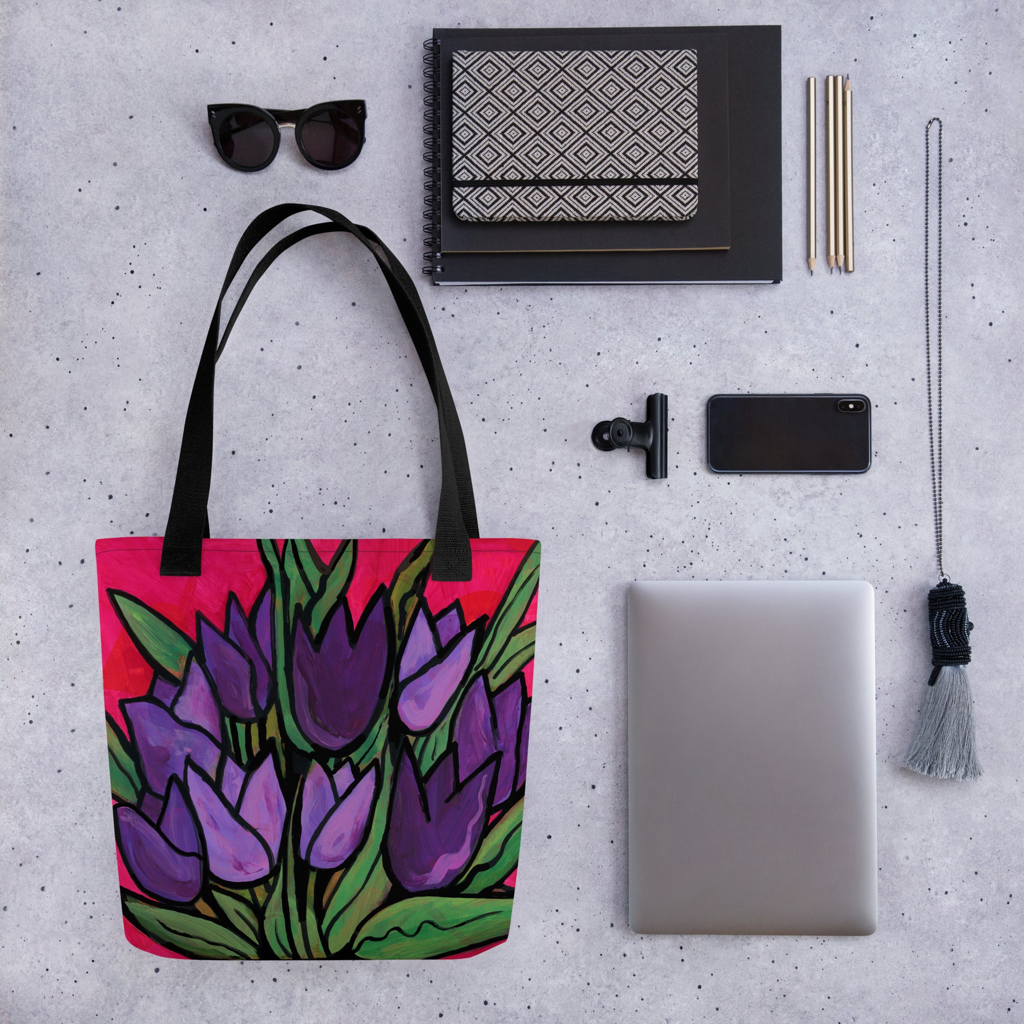 Purple Tulip Passion Tote Bag shown with common items for size comparison - sunglasses, notebooks, agenda, pencils, clip, phone, lanyard, and laptop