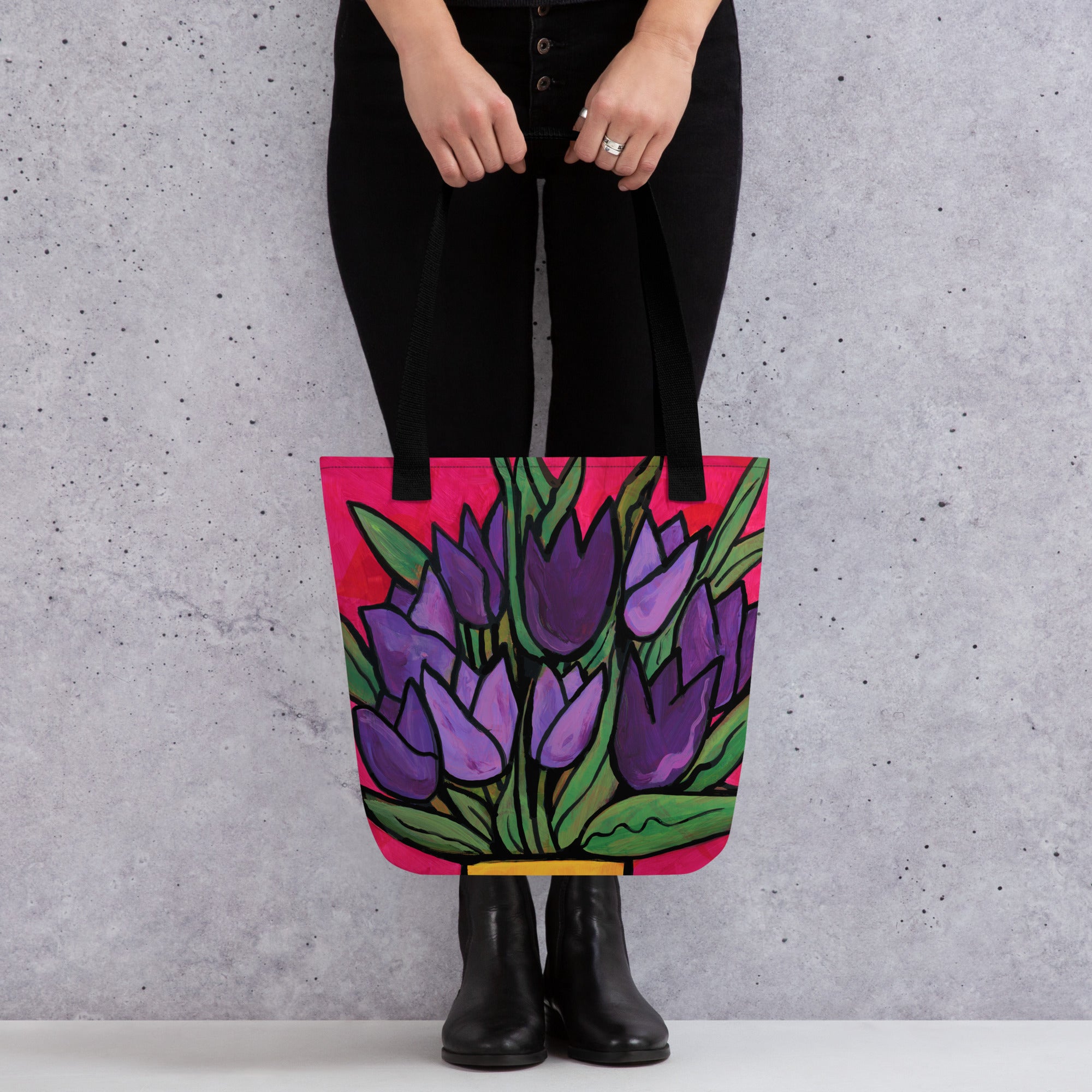 Woman in black clothing holding Purple Tulip Passion Tote Bag