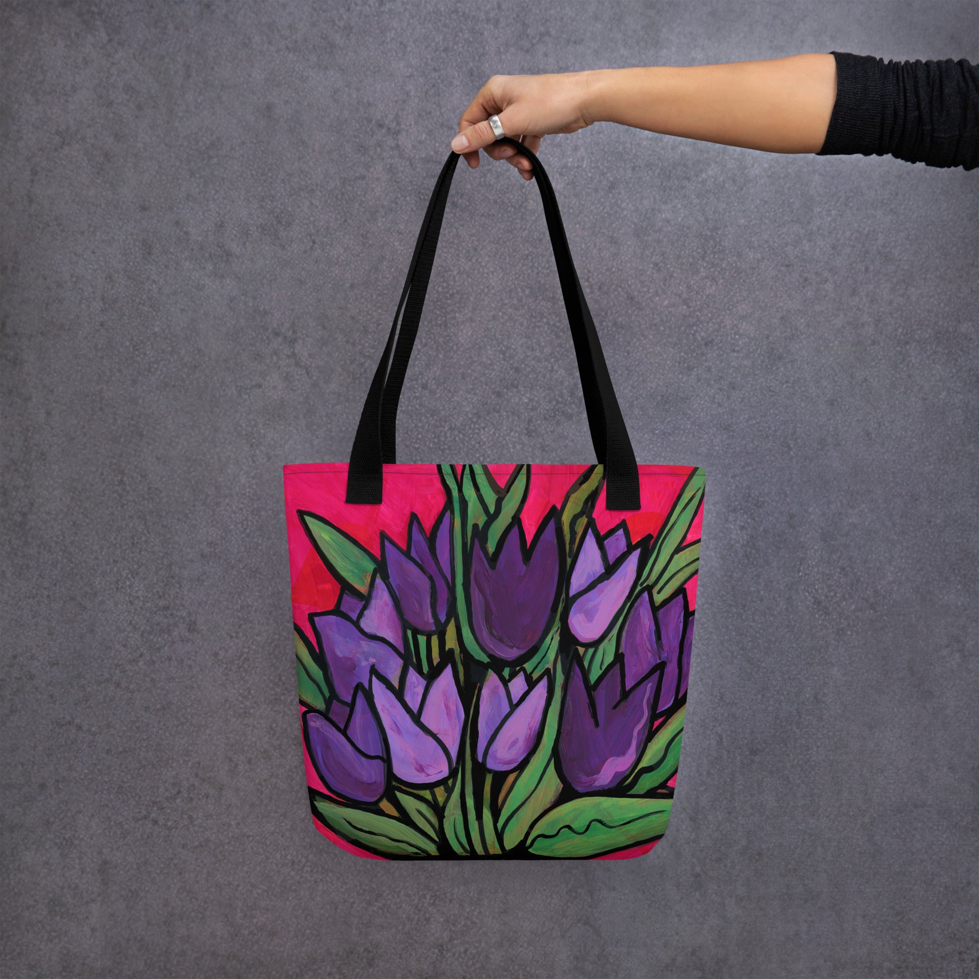Outstretched arm holding Purple Tulip Passion Tote Bag