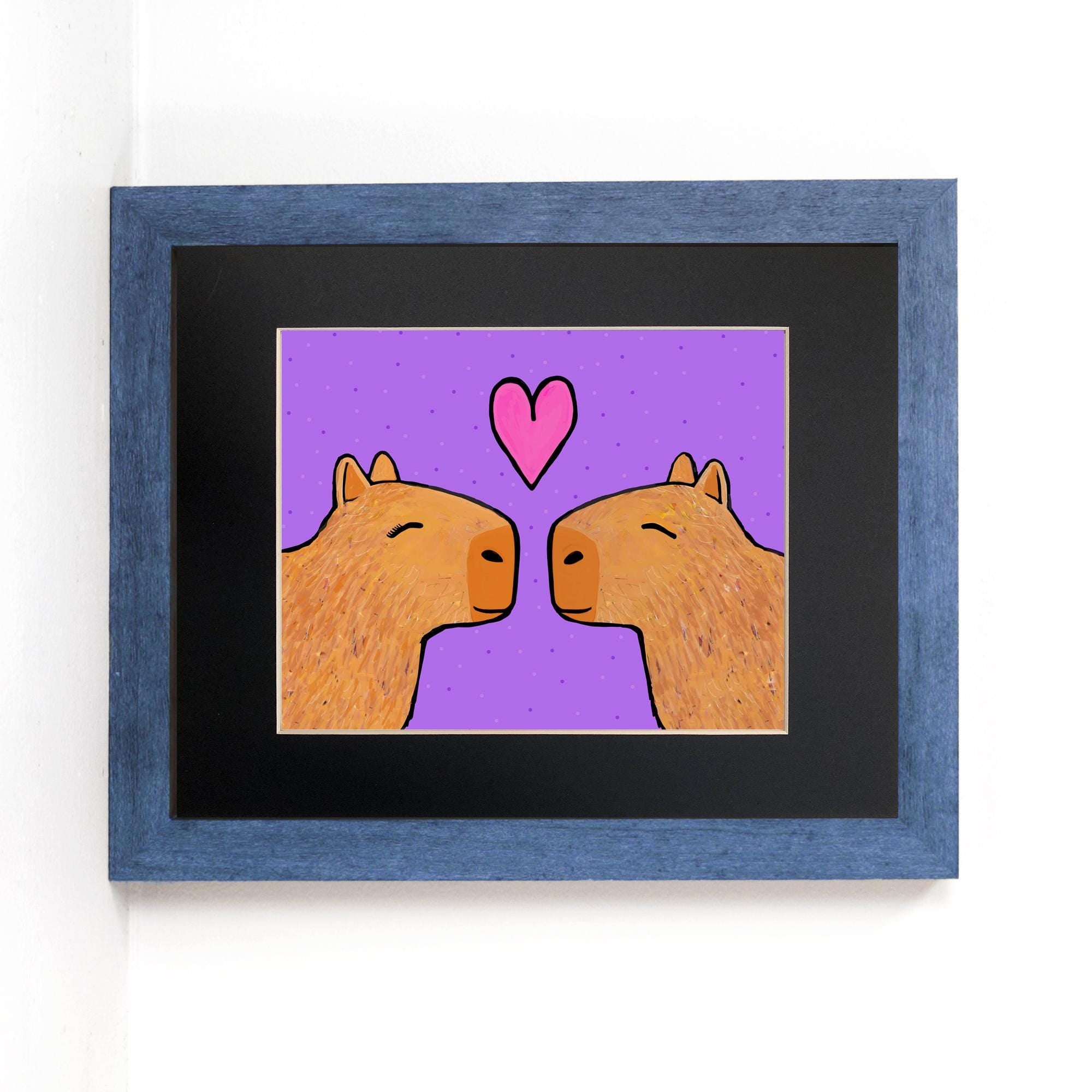 Capybaras in Love art print set in black mat and blue frame