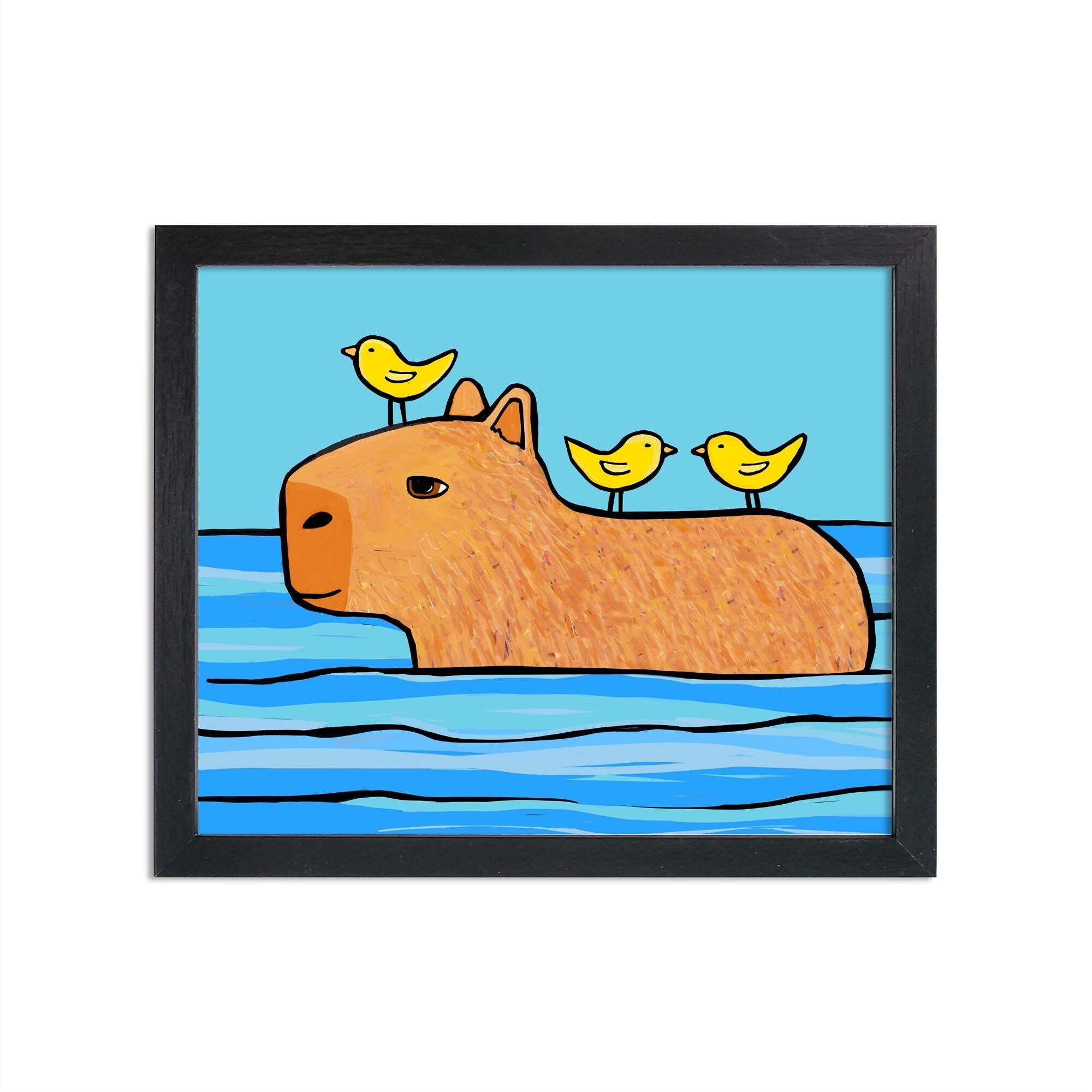 Image of Capybara Friend to All art print in black frame. Art features brown capybara swimming with two yellow birds on it's back and one bird on its head. Background is lighter blue.