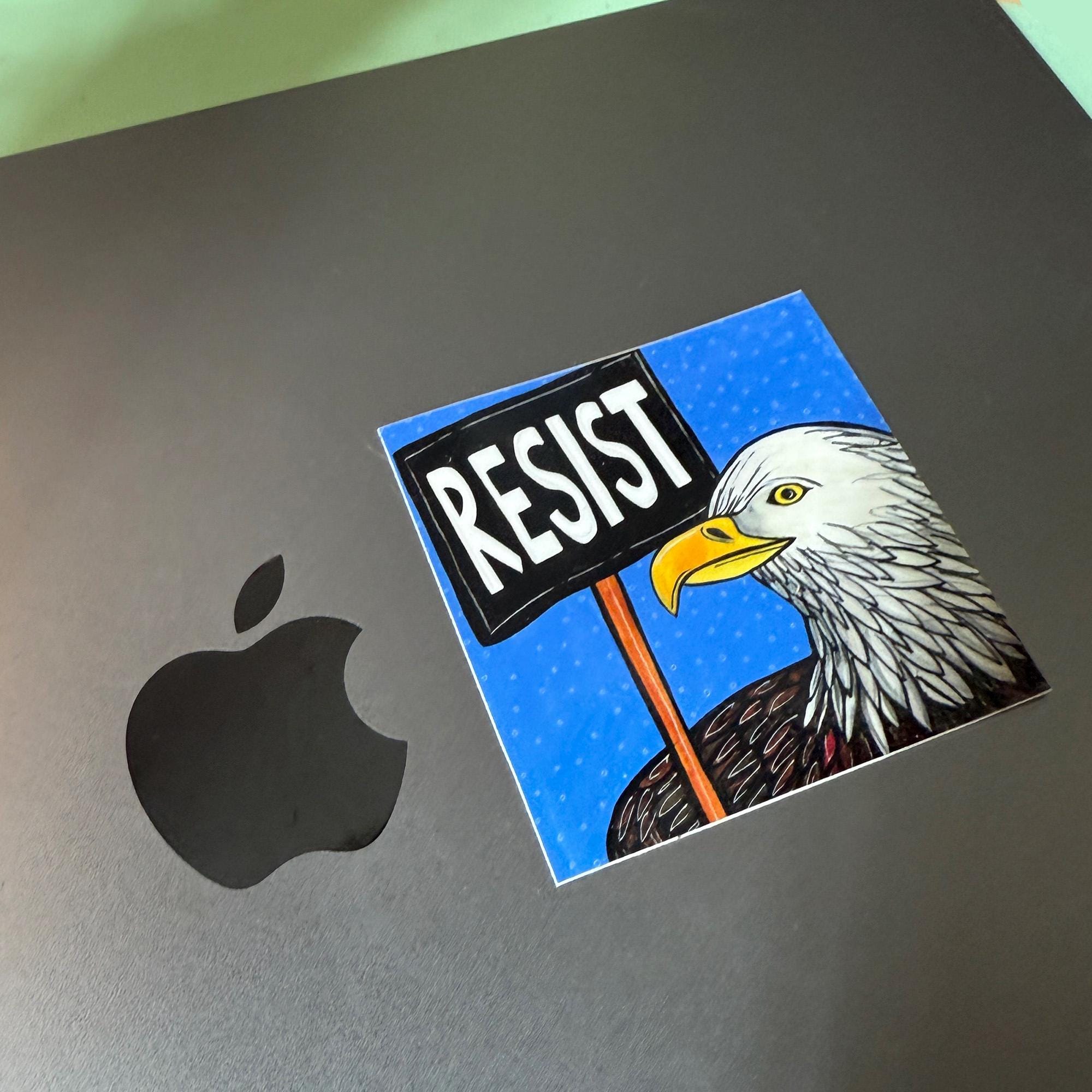 Bald Eagle Resist sticker on a mac laptop