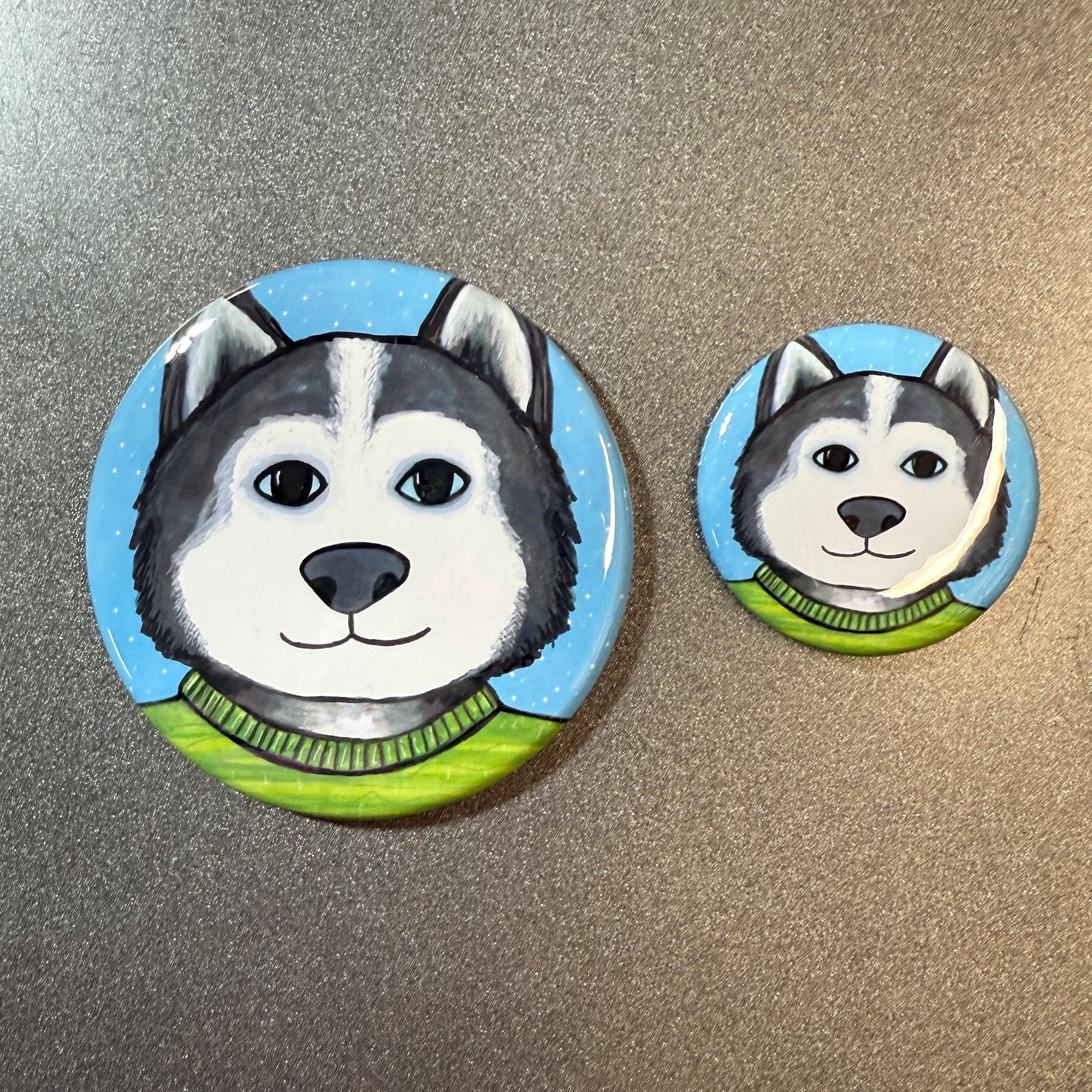 Siberian Husky buttons shown on gray metal surface