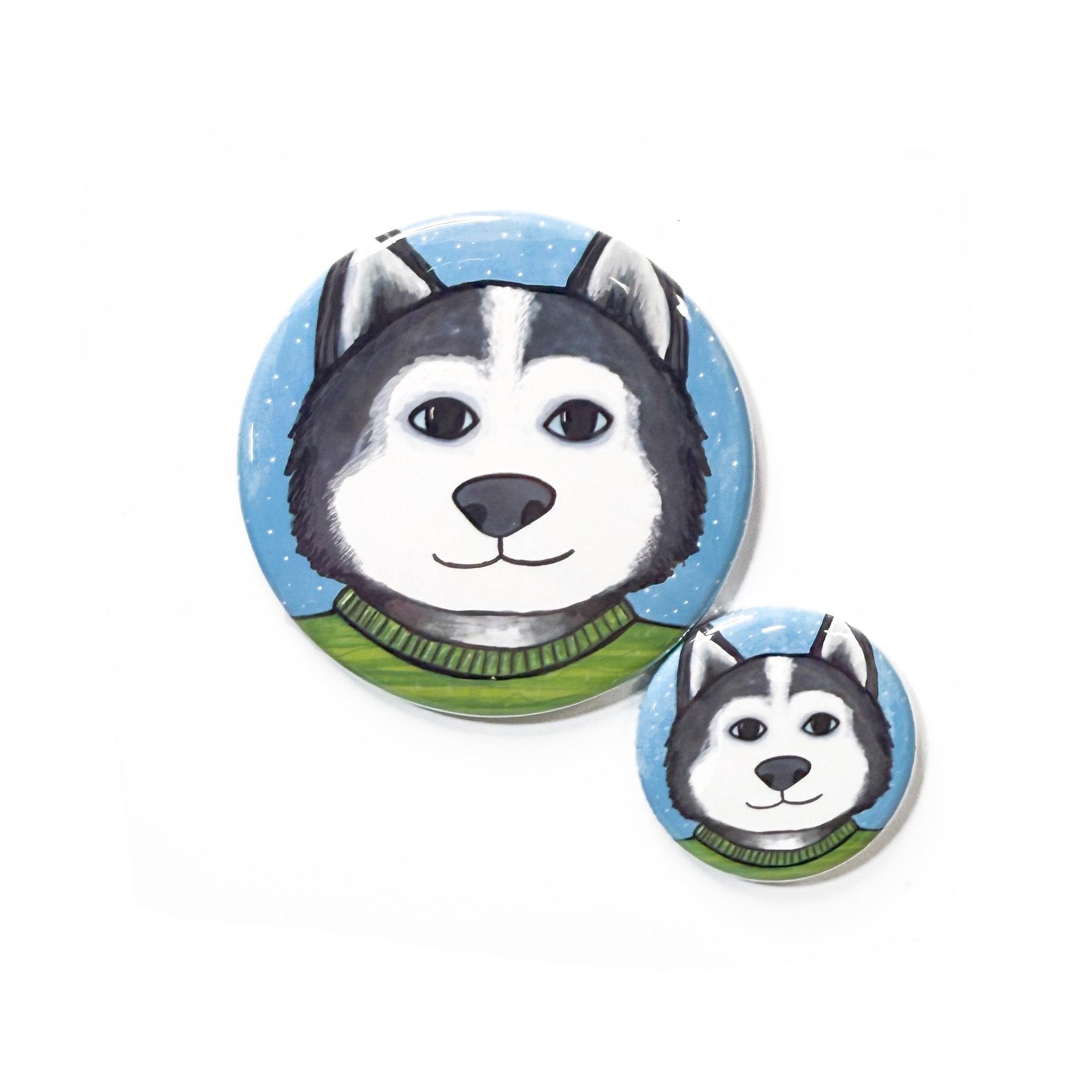 comparative photo of Siberian Husky design in 2 sizes of pins and magnets. 2.25 inch and 1.25 inch.