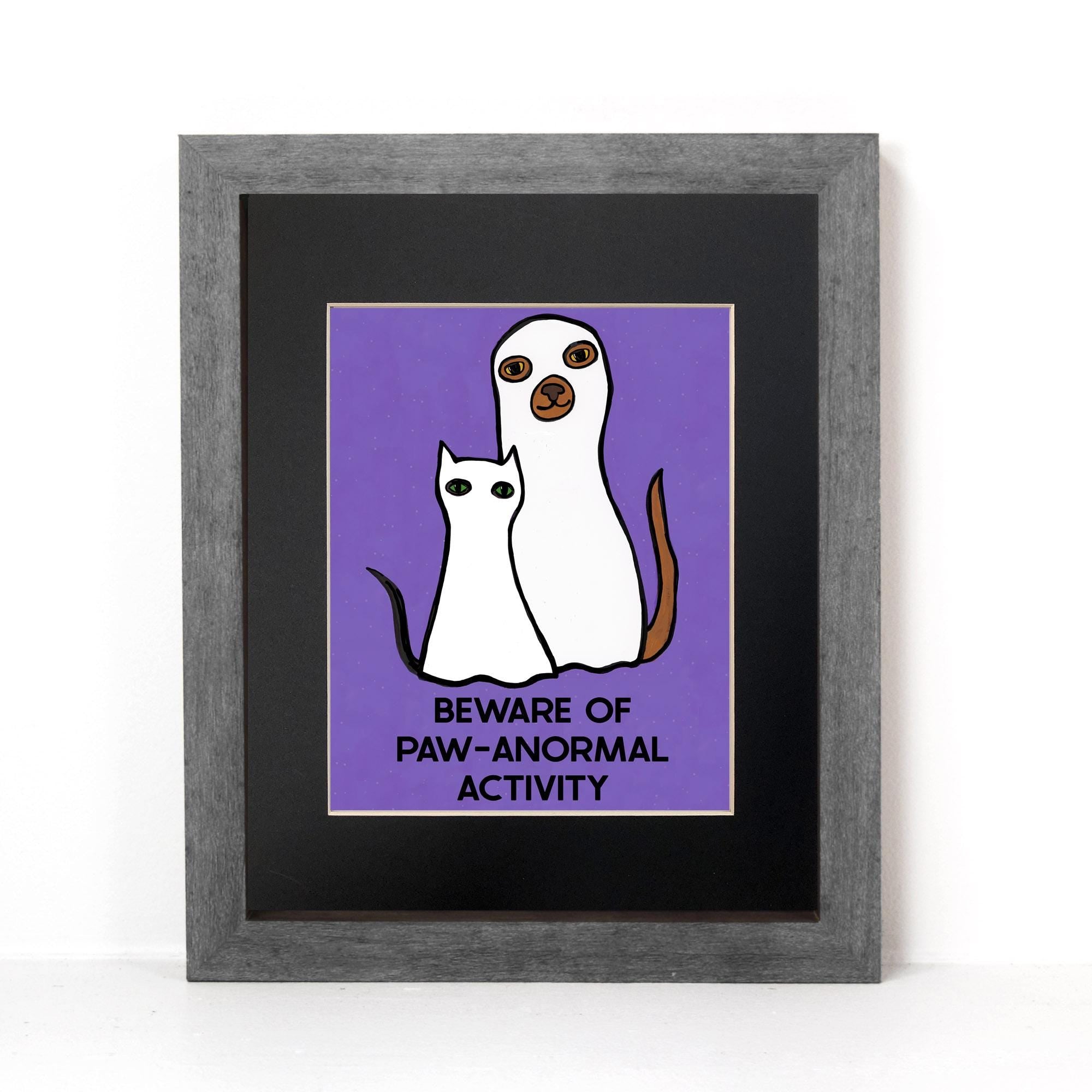 Halloween art print featuring cat and dog in ghost costumes with the words Beware of Paw-anormal Activity on a purple background
