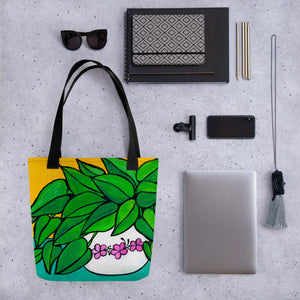 Happy Plant Tote Bag shown with sunglasses, agenda, sketchbook, pencils, phone, clip, lanyard and tablet