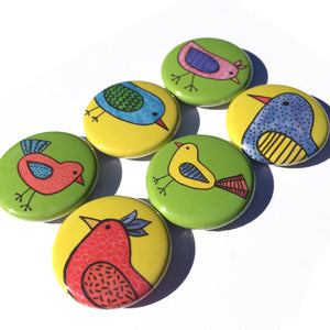 side view of bird buttons