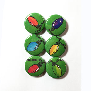 6 round green buttons with different hand drawn christmas lights - orange, purple, blue, yellow, red and green