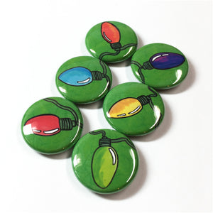 side view of round green magnets with christmas lights in different colors