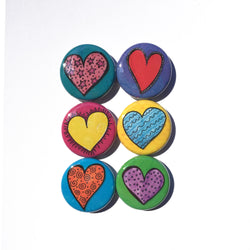 set of 6 round magnets or pins with different colors - pink heart on teal, red heart on purple, yellow heart on pink, blue heart on yellow, orange heart on blue, purple heart on green