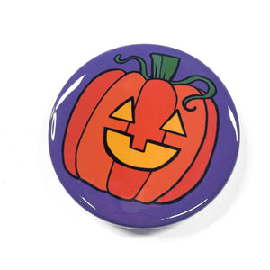 Jack O&#39;Lantern design on magnet, pinback button, or pocket mirror. Orange pumpkin with green stem and vine with yellow happy face on purple background.