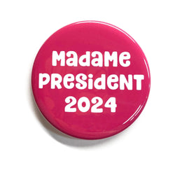 Madame President 2024 - round pink pin or magnet with white lettering