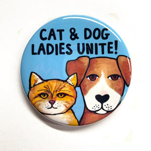 blue button with brown dog and yellow cat with the words cat and dog ladies unite!