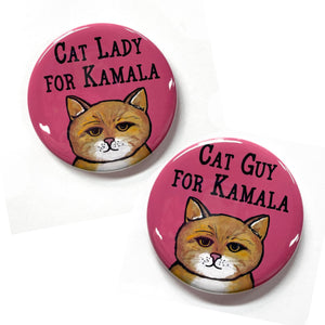 Two pink round buttons with yellow tabby cat. One says Cat Lady for Kamala. The other says Cat Guy for Kamala.