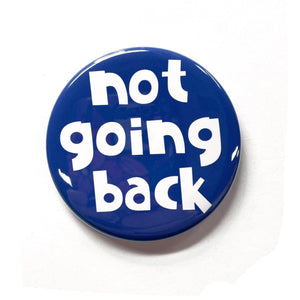 round blue button with chunky white letters that say not going back