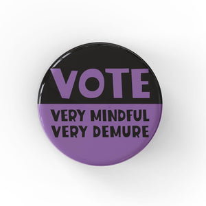 Round button with VOTE in purple on black at the top and VERY MINDFUL VERY DEMURE in black on purple