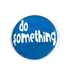 round blue button with the words do something in white