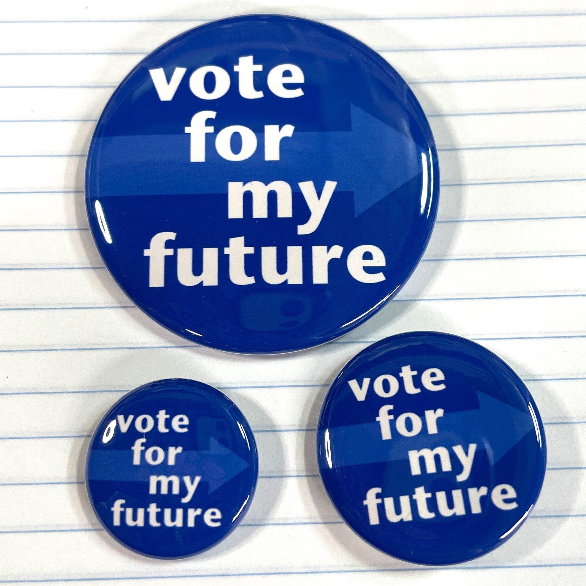 three sizes of vote for my future button shown on lined paper