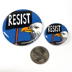 2.25 inch and 1.25 inch Resist pins shown with US quarter coin to illustrate size comparison.