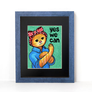 Rosie the Cat print shown in blue frame with black mat