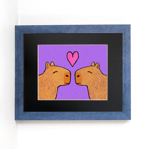 Capybaras in Love art print set in black mat and blue frame