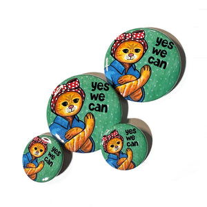 group photo of Rosie the Cat Yes We Can pins and magnets in both sizes