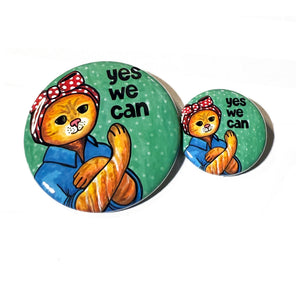 side by side comparison of Rosie the Cat Yes We Can buttons in 1.25 inch and 2.25 inch sizes