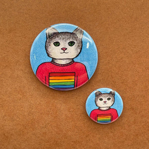Sample sizes of Sarah the Cat Pride button - 1.25 inch and 2.25 inch