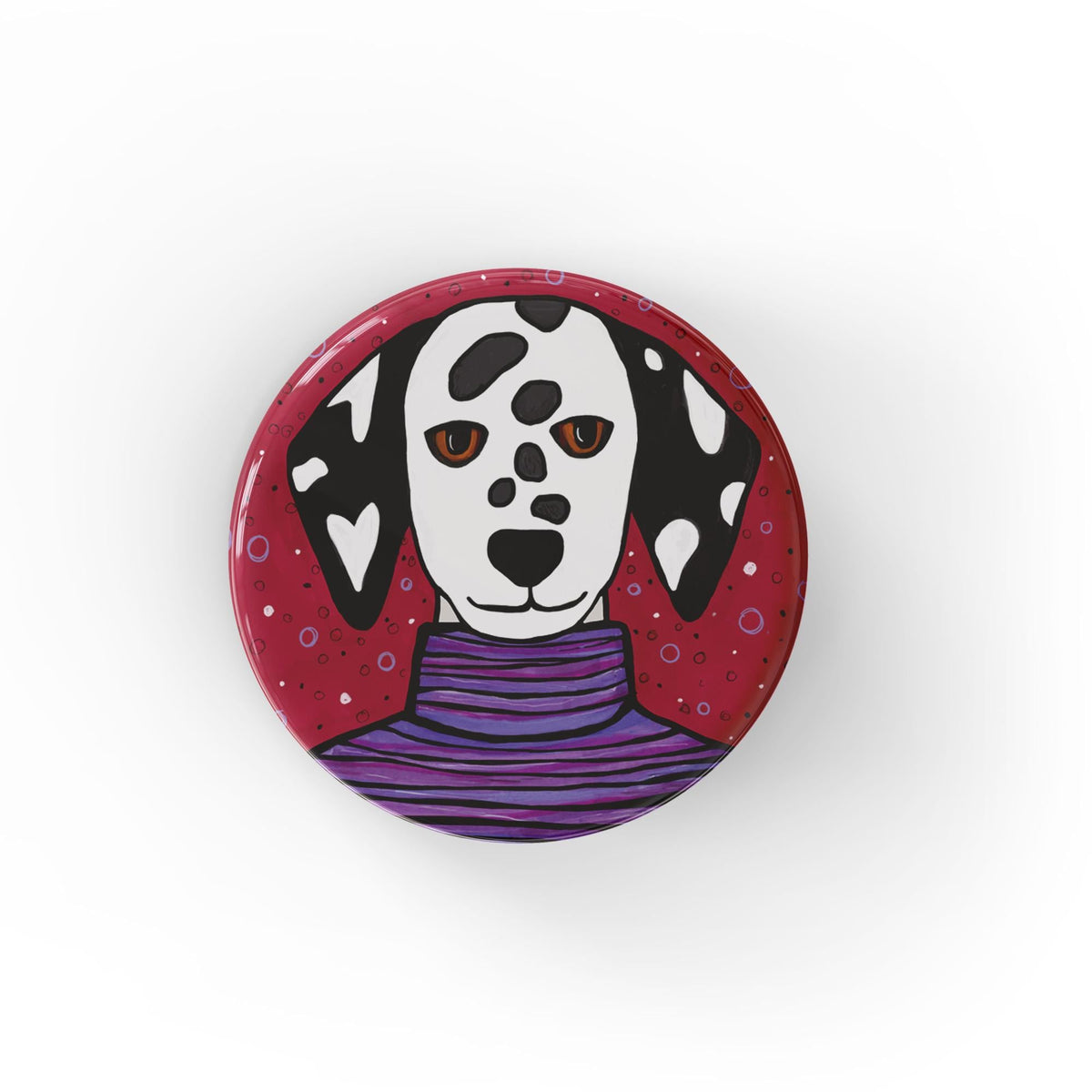Round button featuring black and white dalmation dog in a purple striped turtleneck on a red background with multicolor dots. Available as pinback buttons and fridge magnets.
