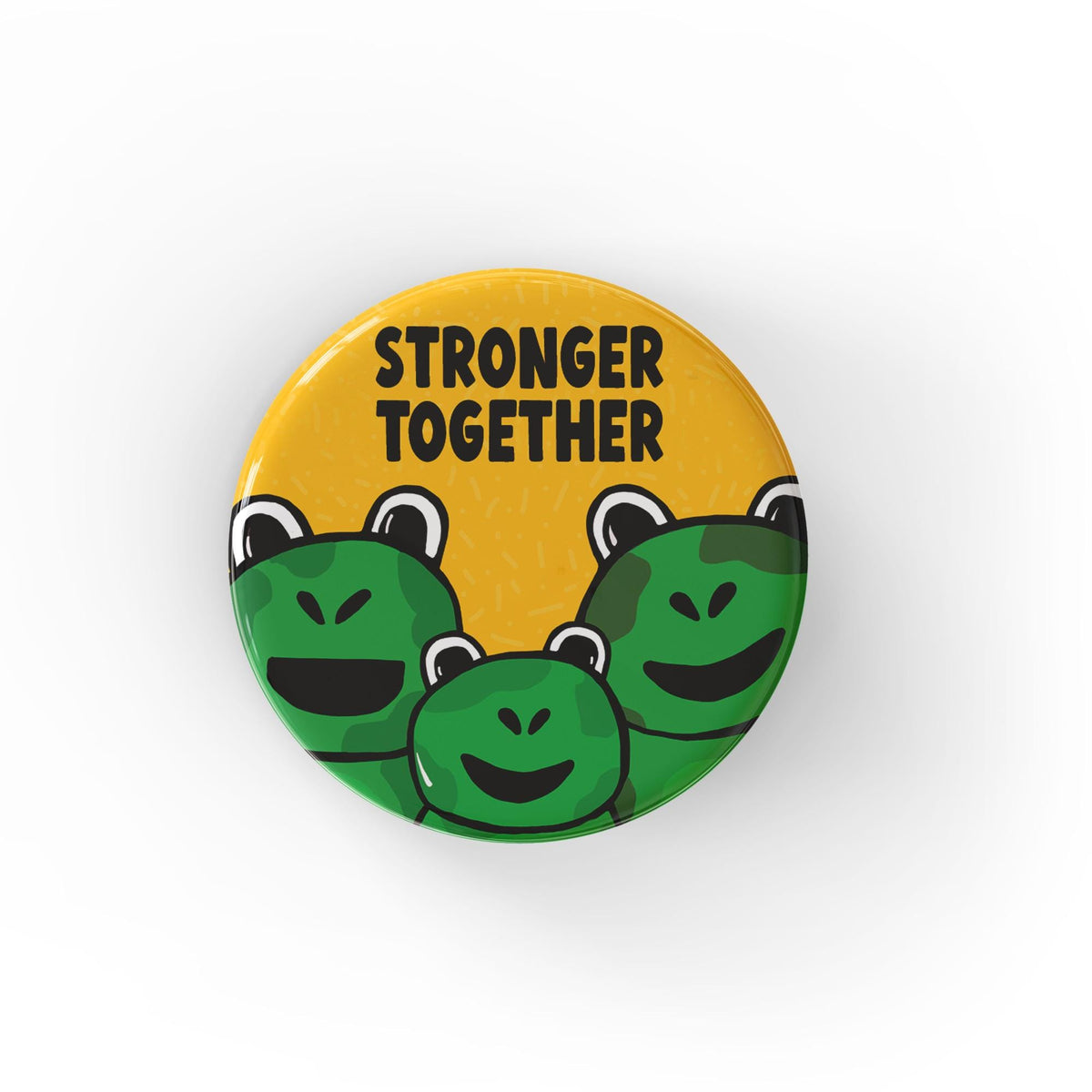 Round yellow button with the words Stronger Together in black with a group of 3 frogs - two adult size and one smaller child size frog