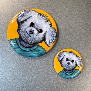 close up view of Millie the Shih Tzu dog buttons - 2.25 inch and 1.25 inch on gray metal background