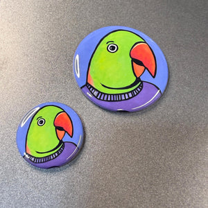 Comparison view of the 2.25 inch and 1.25 inch alexandrine parrot buttons
