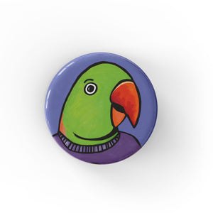 round button with a green alexadrine parrot bird&#39;s head on a purplish blue background