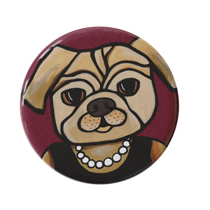 round button with a pug dog. Dog is wearing a black sleeveless dress and pearl necklace. the background is deep cranberry. available as a magnet or pin or pocket mirror