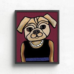 art print featuring pug in a black dress with blue belt and white pearl necklace on a deep cranberry background. print is shown in a black frame on a white wall.