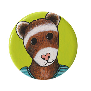 bright green round button featuring a brown and white ferret with a pink heart nose in a blue sweater