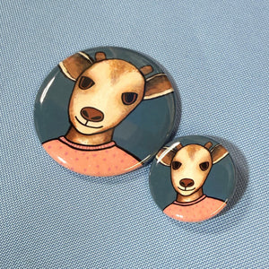comparison view of 2.25 inch and 1.25 inch goat buttons