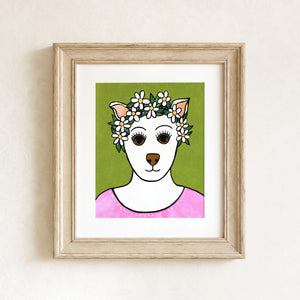 8x10 Falline the Fairy Dog Princess art print features a white dog with brown nose and eyes with a daisy and leaf crown. She is wearing a pink dress with white dot accents. The background is light green with white polka dots. It is shown in light wood frame with white mat. Frame is not included.
