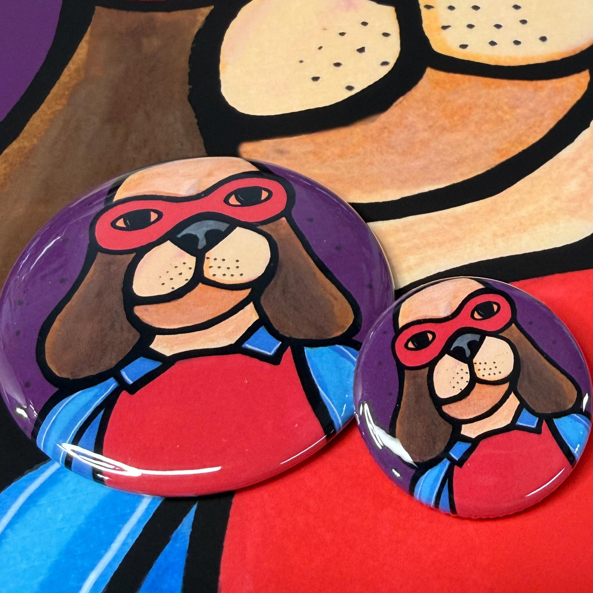 2.25 inch and 1.25 inch buttons with halloween dog in super hero costume - shown on super hero dog print