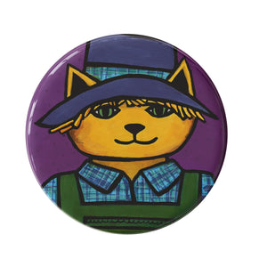 round purple button with yellow cat dressed as a scarecrow