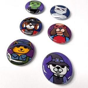 cat and dog halloween buttons on a white background