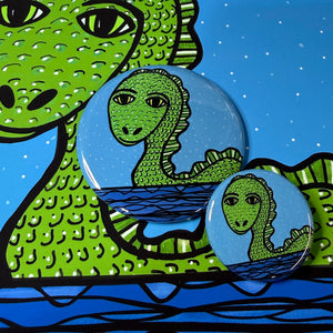 two sizes of lochness monster button - 1.25 and 2.25 inch