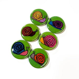 round green buttons with colorful snails of different colors