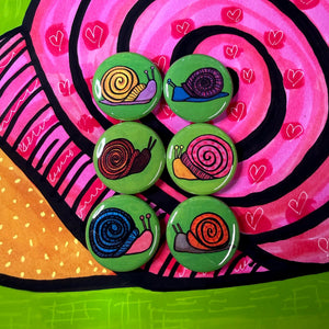 another view of round snail button set on snail art print