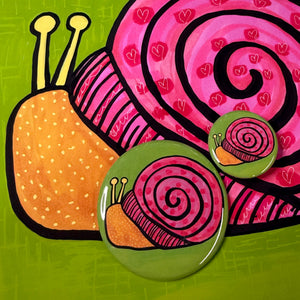 yellow and pin snail button - 2 different sizes - 1.25 inch and 2.25 inch - shown on a snail art print