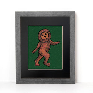 alternate view of Bigfoot art print in a gray frame with black mat