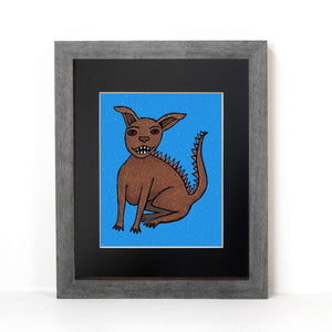 another view of chupacabra shown in gray frame with black mat