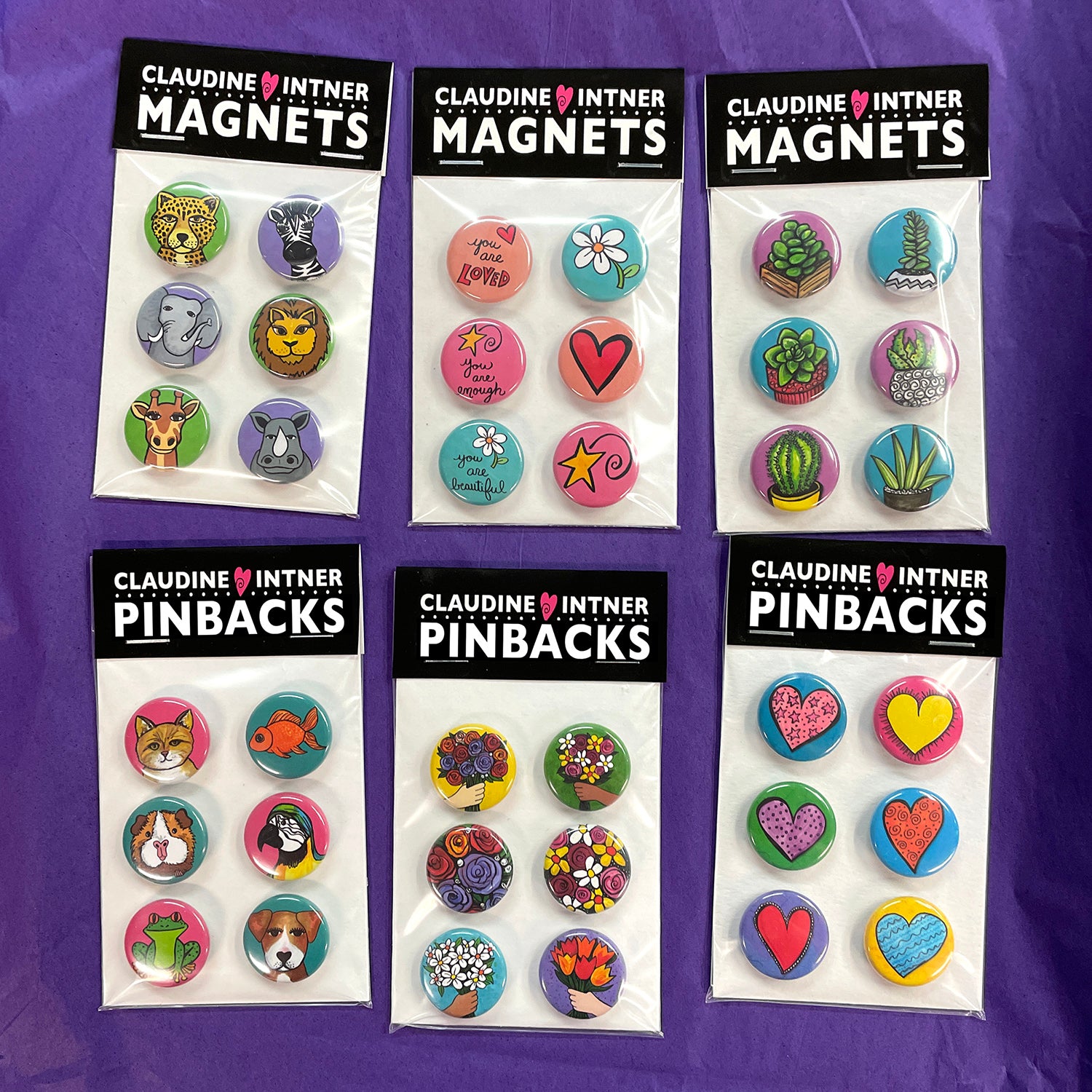 sample packaging of magnet and pin sets - black label with buttons on white board